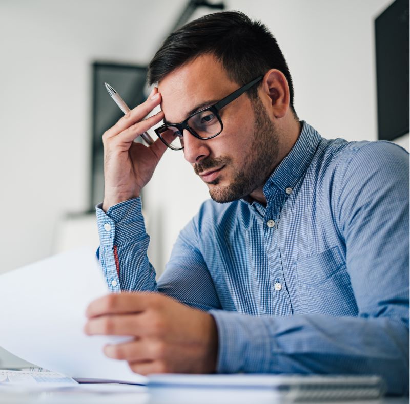 Portrait of a man reviewing documents